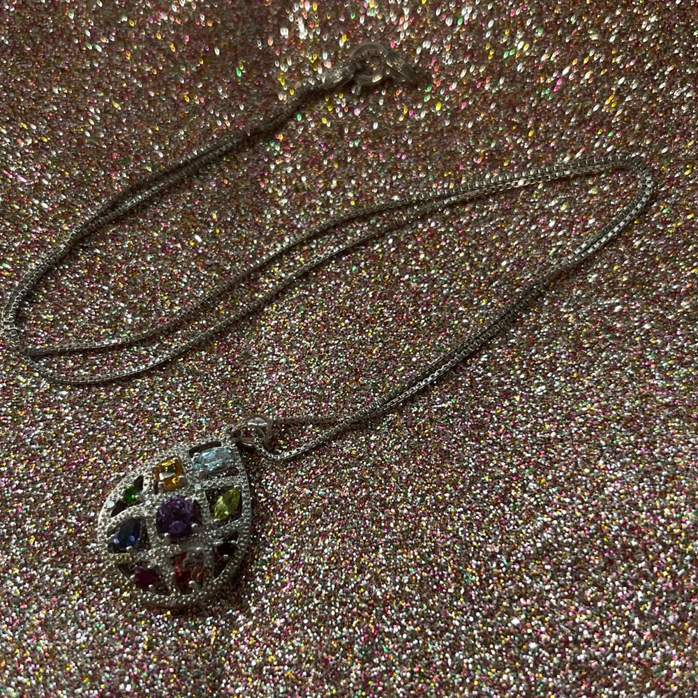 Sterling silver necklace with multi colored stones.